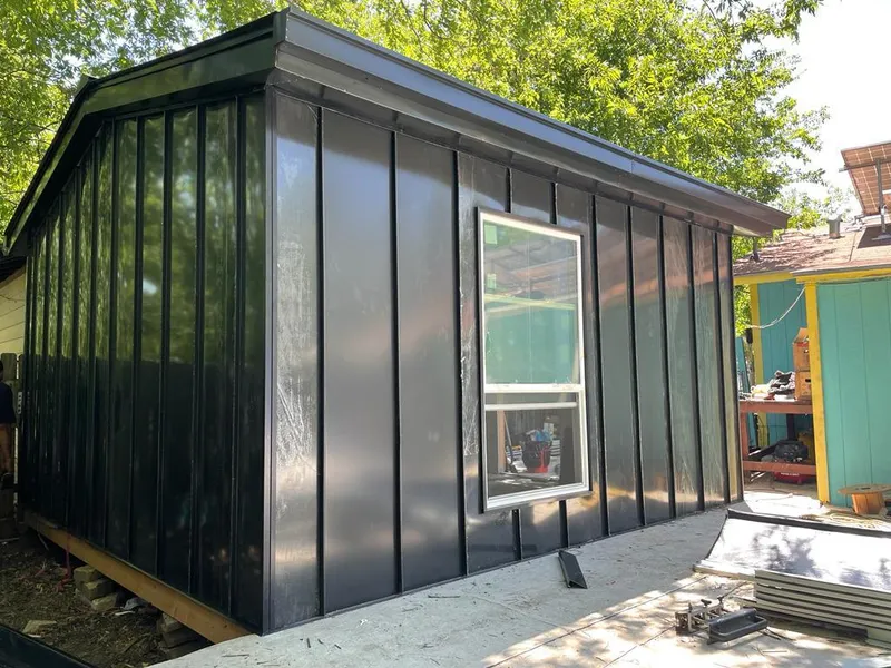 Black standing seam metal wall panels for Metal Roof Installation in St. Michael