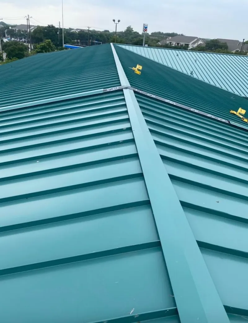 Green commercial metal roof ridge and valley for Metal Roof Repair in St. Michael