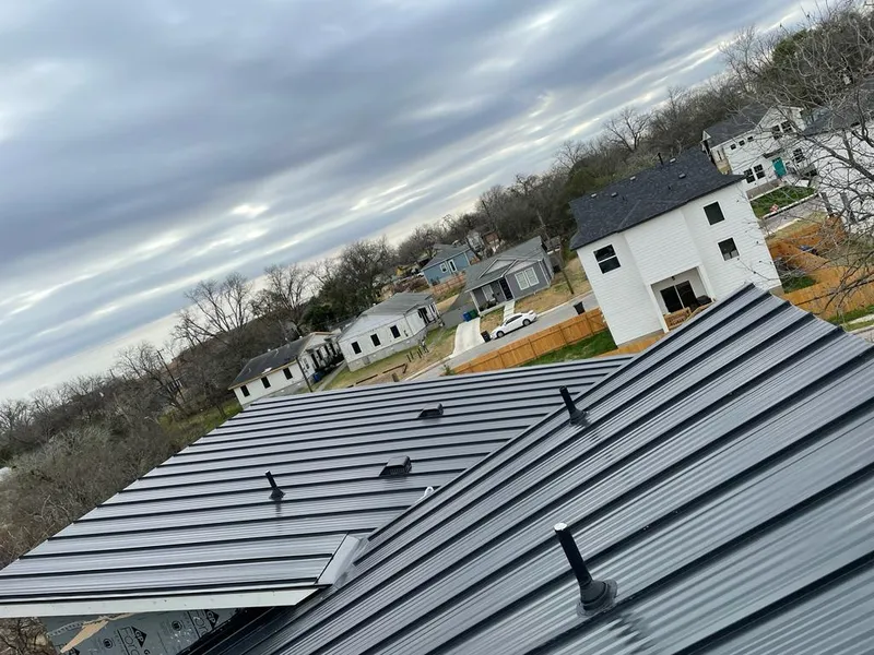 Standing seam metal roof panels with vents for Skylight Repair in St. Michael